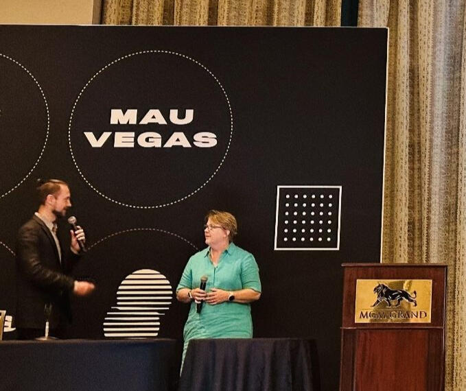 Stacy Earl speaking on stage at MAU Vegas 2023